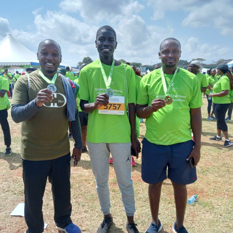 KIPPRA staff posing with their medals after completing the marathon