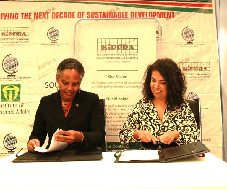 KIPPRA Executive Director Dr Rose Ngugi  (left) and  IPEA President Dr Luciana Mendes Santos Servo (right) signing the MOU