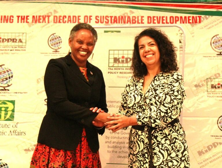 KIPPRA Executive Director  Dr Rose Ngugi (left) and  IPEA President Dr Luciana Mendes Santos Servo (right) shaking hands after signing of the MOU.