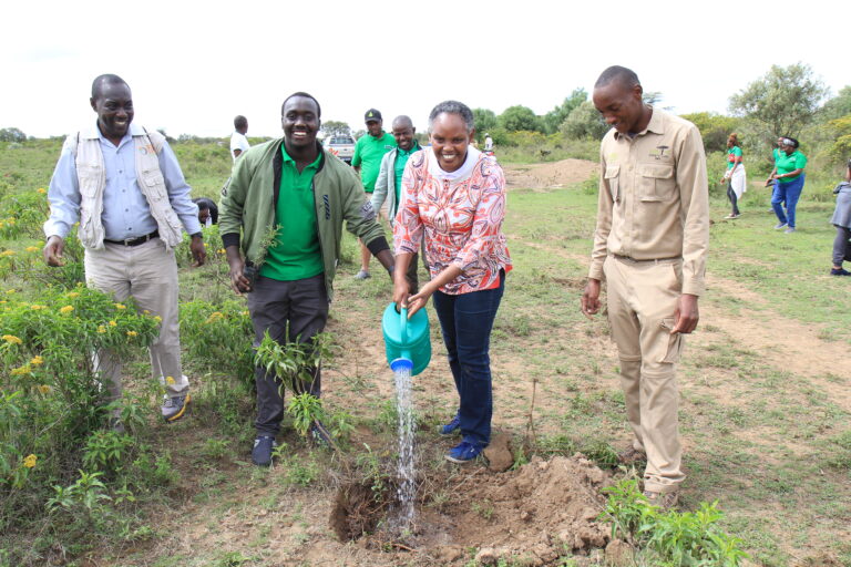 KIPPRA Executive Director Dr Rose Ngugi (centre) plants tree at the Naivasha Game Farm