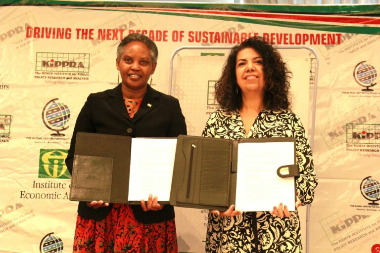 KIPPRA Executive Director Dr Rose Ngugi (left) and IPEA President Dr Luciana Mendes Santos Servo (right) pose for a photo after signing the MOU