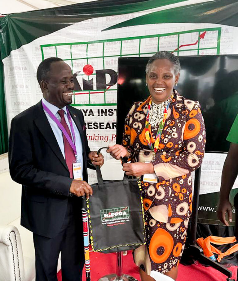 Trans Nzoia Governor H.E George Natembeya (right) with KIPPRA Executive Director Dr Rose Ngugi (left) at the Conference